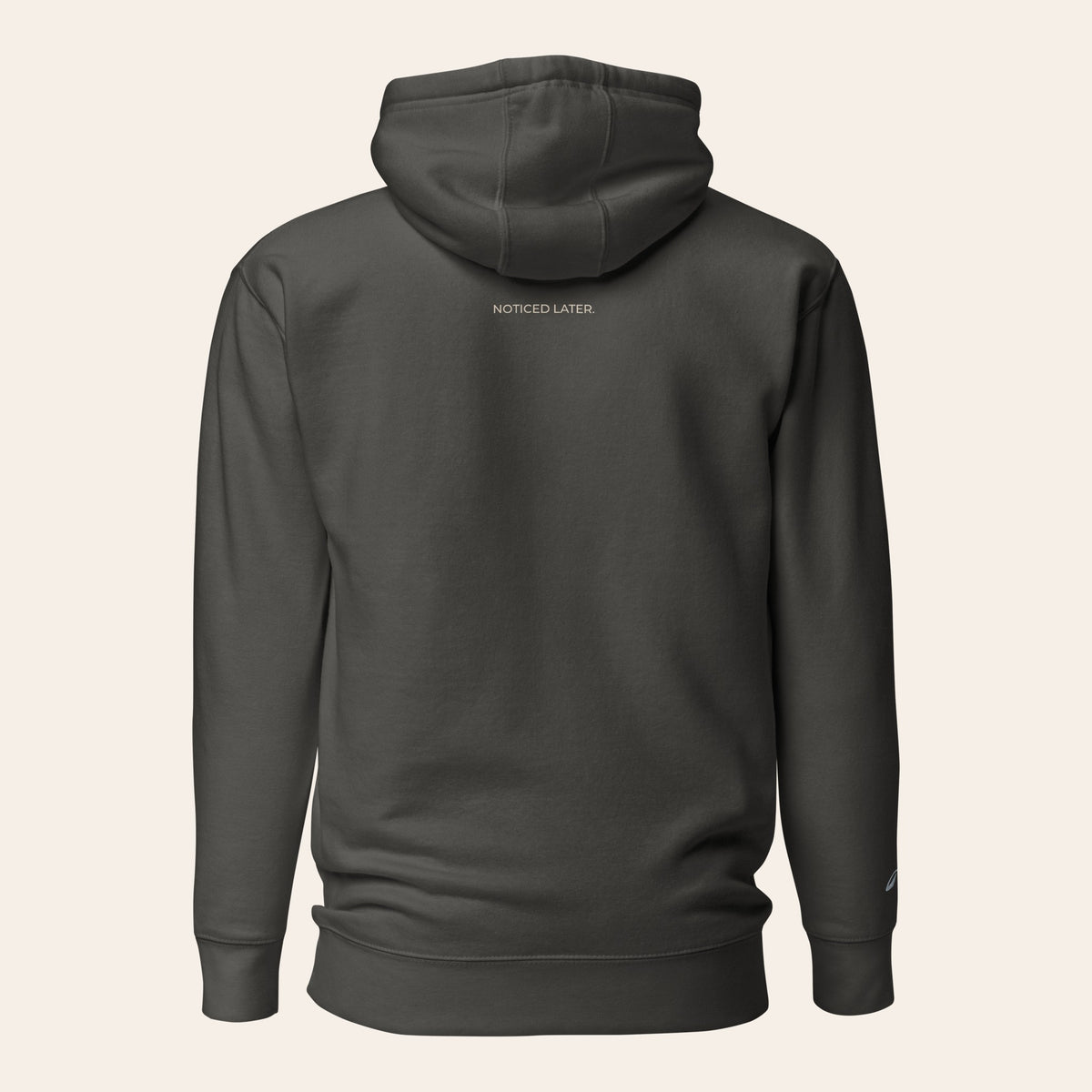 LOUPI GANG Noticed Later Hoodie in Vintage Black, back view, NOTICED LATER. printed in sand just below the hood.