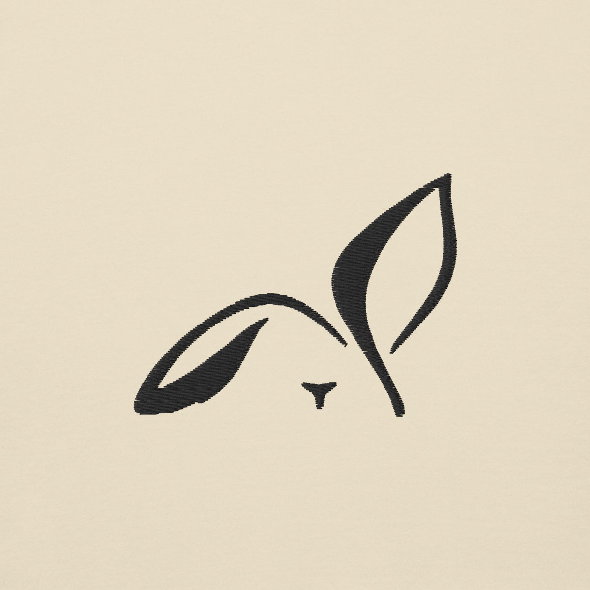 Close-up of the black embroidered LOUPI GANG rabbit on the left chest of the Bone Morning Edition Crew.