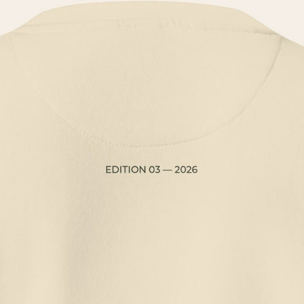 Close-up of the back of the Morning Edition Crew, EDITION 03 — 2026 printed in olive under the collar.