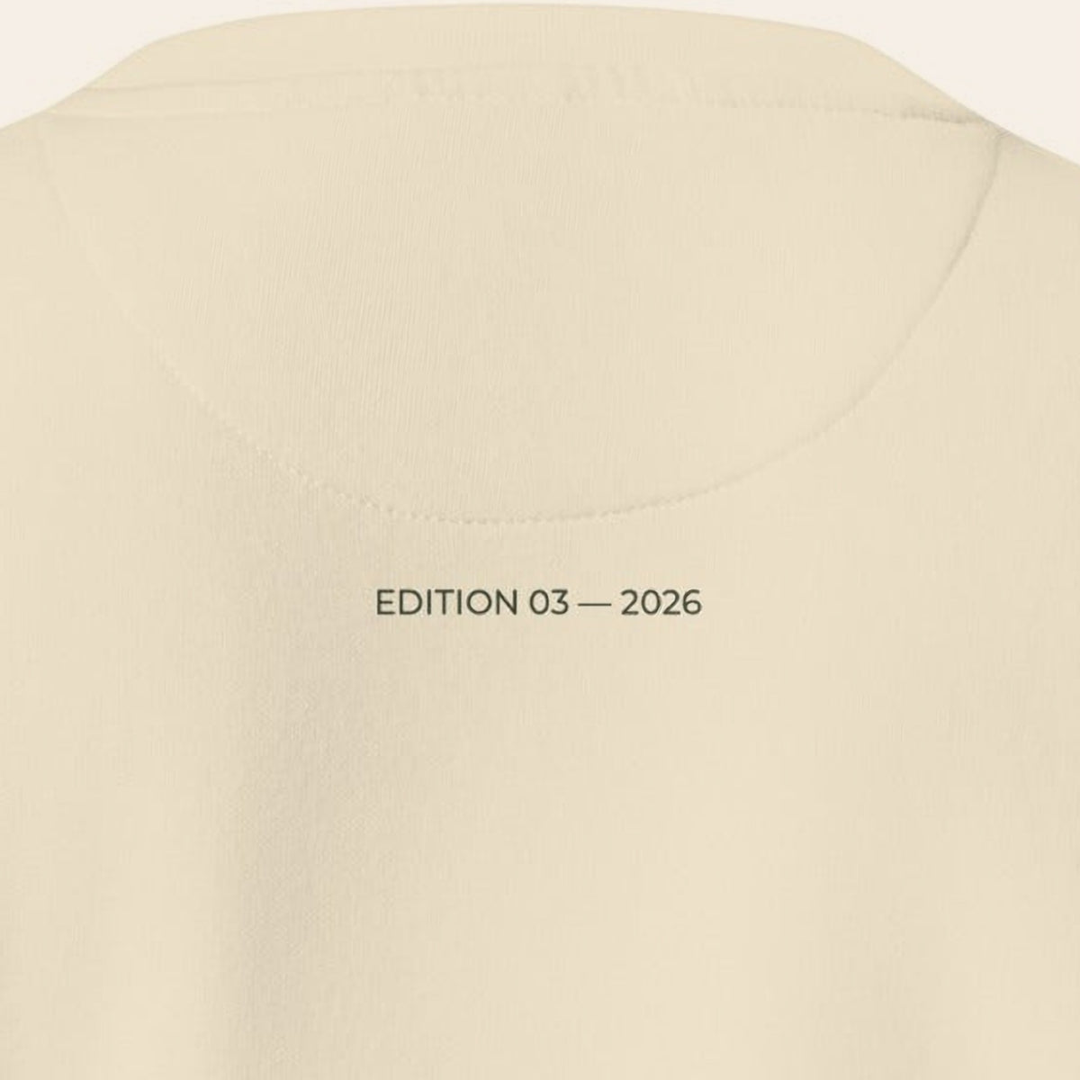 Close-up of the back of the Morning Edition Crew, EDITION 03 — 2026 printed in olive under the collar.