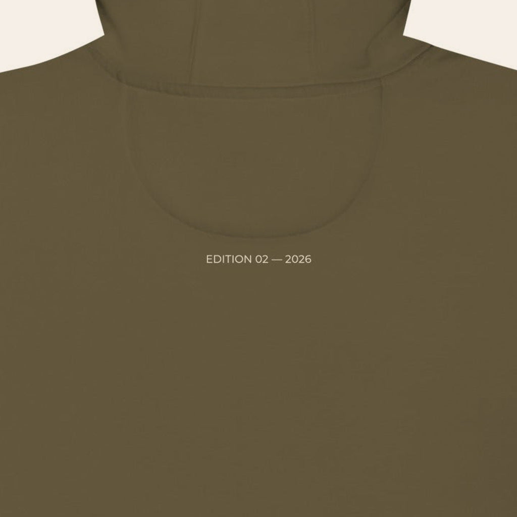 Close-up of the back of the Second Look Hoodie, EDITION 02 — 2026 printed in sand under the hood.