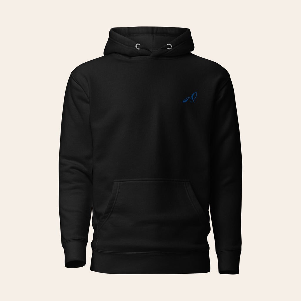 Black LOUPI GANG Quiet Rebel pullover hoodie, front view, with a small blue embroidered rabbit logo on the left chest. Product mockup.